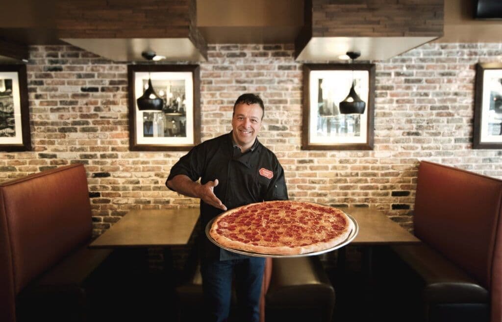 Chef Anthony Russo preparing pizza