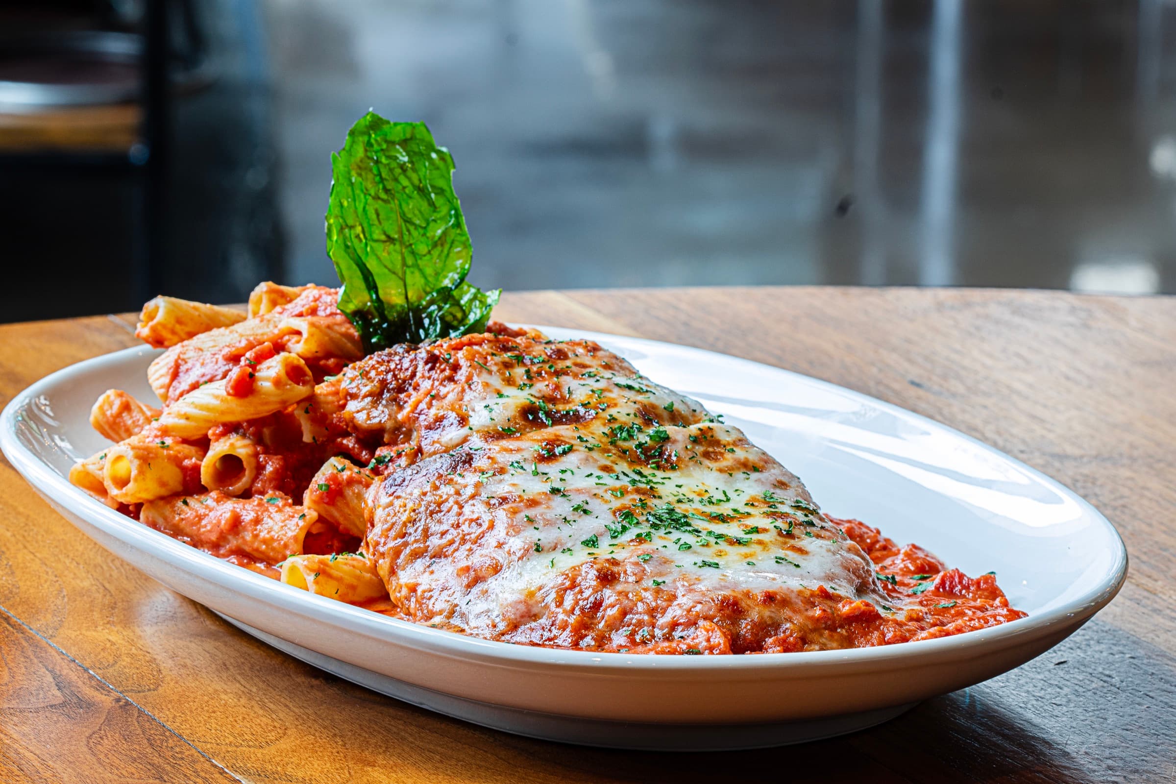 Anthonys vodka chicken Parmigiana with rigatoni and fresh basil